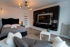 Posteľ alebo postele v izbe v ubytovaní Apartament Nero