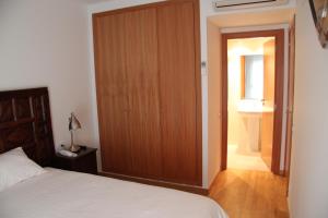 Posteľ alebo postele v izbe v ubytovaní Apartaments Centre Figueres