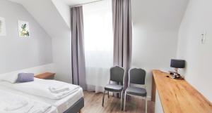 Postel nebo postele na pokoji v ubytování SOKÓŁ
