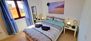 Postel nebo postele na pokoji v ubytování Ferienhaus CASA MAJA Costa Calma Meerblick Garten