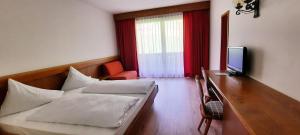 Ένα ή περισσότερα κρεβάτια σε δωμάτιο στο Smart Hotel Firn