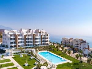Výhled na bazén z ubytování Olée Torrox Costa Holiday Rentals by Fuerte Group nebo okolí