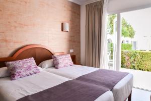Postel nebo postele na pokoji v ubytování Hotel d'Or