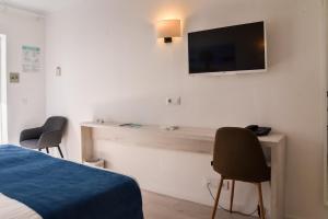 TV a/nebo společenská místnost v ubytování Hotel d'Or