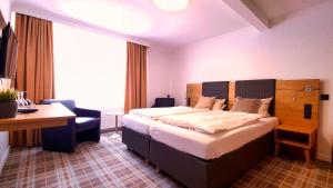 Łóżko lub łóżka w pokoju w obiekcie Hotel Holländer Hof