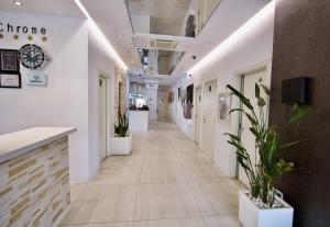 a hallway in a store with a clock on the wall at SV Chrome in Abuja