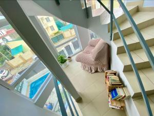 an overhead view of a room with stairs and a chair at Апарт-отель Five-story in Adler