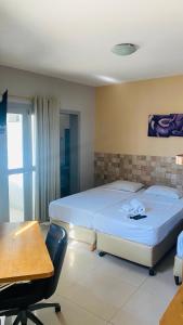 Voodi või voodid majutusasutuse Hotel Italia Beach toas