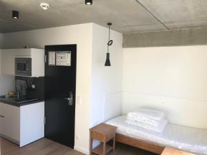 Kuchyň nebo kuchyňský kout v ubytování SITE.INN Hamburg
