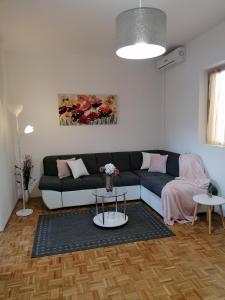 a living room with a couch and a table at Kuća za odmor Ana in Ražanac