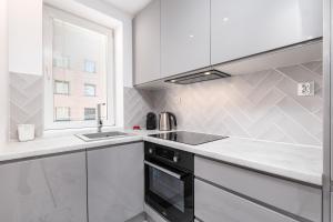 Kuchyňa alebo kuchynka v ubytovaní Apartament Moniuszki by Your Freedom