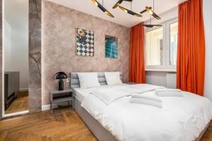 Posteľ alebo postele v izbe v ubytovaní Apartament Moniuszki by Your Freedom
