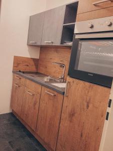 a kitchen with a sink and a stove at Ferienwohnung Paula Winterberg in Winterberg