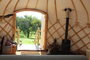 an open door of a yurt with a door openhaarhaarhaarhaarhaar at Blossom Orchard - Luxury Yurts in Langport