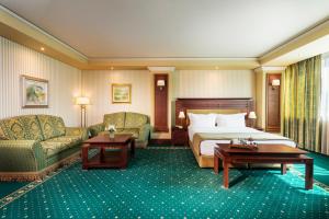 A bed or beds in a room at Grand Hotel Sofia