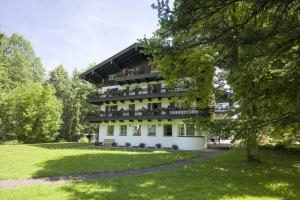 a building with balconies on it in a park at Haus Auerbach in Oberaudorf