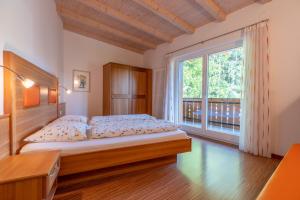 Postel nebo postele na pokoji v ubytování Residence Neuhäuslhof + 48 fotografií