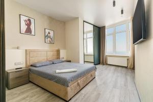 Posteľ alebo postele v izbe v ubytovaní Sea Symphony Design Apartment