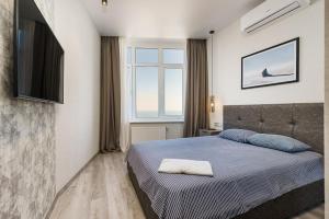 Posteľ alebo postele v izbe v ubytovaní Sea Symphony Design Apartment