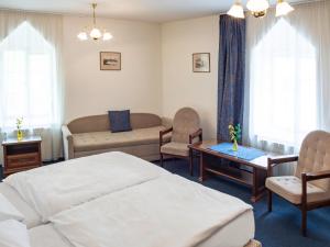 Postel nebo postele na pokoji v ubytování EA Apartmány Mozart + 37 fotografií
