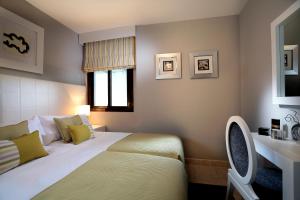 Een bed of bedden in een kamer bij Macdonald La Ermita Resort