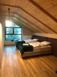 A bed or beds in a room at Paramount Kazbegi