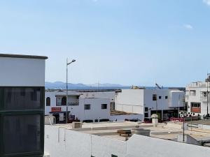 a view of a city from the roof of a building at Apartamento Catalina in Playa Blanca +5 photos
