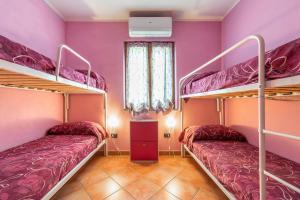 Postel nebo postele na pokoji v ubytování Casa Giovanna e Antonio