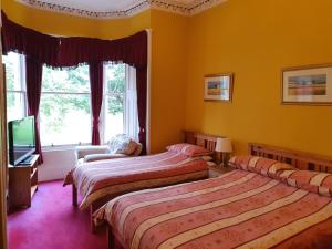 מיטה או מיטות בחדר ב-Mackenzie Guest house