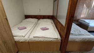 Postel nebo postele na pokoji v ubytování Penzion Na Sluníčku