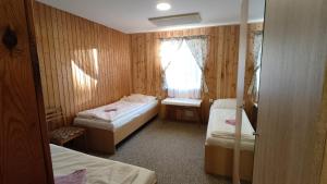 Postel nebo postele na pokoji v ubytování Penzion Na Sluníčku + 37 fotografií