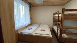 Postel nebo postele na pokoji v ubytování Penzion Na Sluníčku
