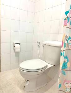 a bathroom with a white toilet in a room at Baan Chomphu Pakchong in Ban Nong Sarai (1)