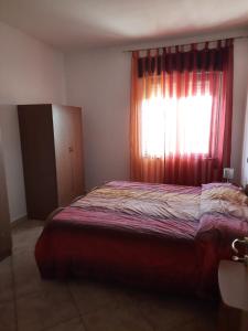 Posteľ alebo postele v izbe v ubytovaní La Rosa dei Venti Apartments Two