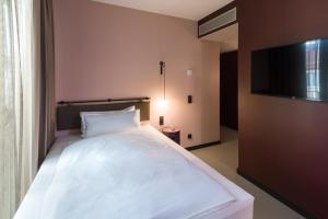 Letto o letti in una camera di EmiLu Design Hotel