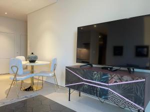 TV o dispositivi per l'intrattenimento presso ADDRESS BEACH Residence