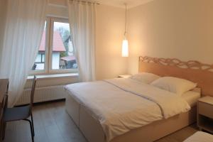 Posteľ alebo postele v izbe v ubytovaní Apartamenty Doliny