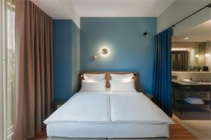 Letto o letti in una camera di EmiLu Design Hotel