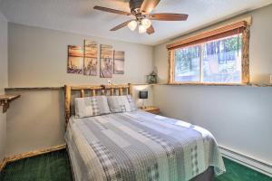 a bedroom with a bed and a ceiling fan at Spacious Black Hawk Home with Furnished Deck! in Blackhawk +32 photos