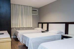 En eller flere senge i et værelse på Master Express Alberto Bins - 200 metros do Hospital Santa Casa