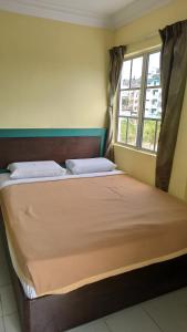 Postel nebo postele na pokoji v ubytování Ria Cameron Hotel