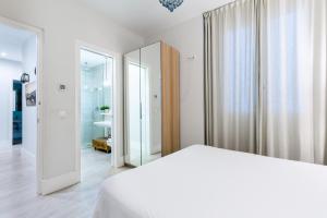 Posteľ alebo postele v izbe v ubytovaní AoA Green Gardens Suites