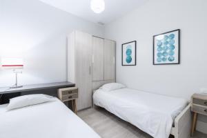 Posteľ alebo postele v izbe v ubytovaní AoA Green Gardens Suites
