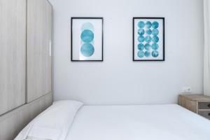 Posteľ alebo postele v izbe v ubytovaní AoA Green Gardens Suites