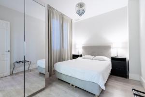 Posteľ alebo postele v izbe v ubytovaní AoA Green Gardens Suites