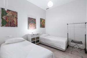 Posteľ alebo postele v izbe v ubytovaní AoA Green Gardens Suites