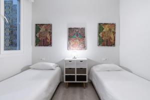 Posteľ alebo postele v izbe v ubytovaní AoA Green Gardens Suites