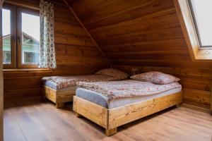 Posteľ alebo postele v izbe v ubytovaní uDany Villa Apartament