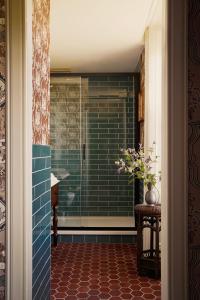 a bathroom with a shower with a glass door at Rusacks St Andrews in St. Andrews
