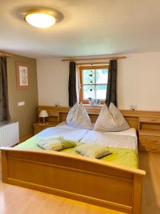 A bed or beds in a room at Waldruhe Appartements